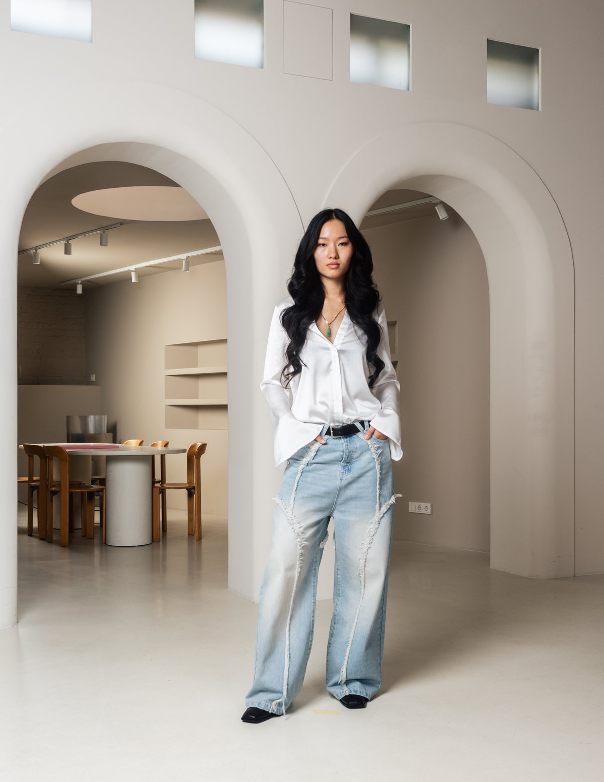VERA Volume 01 — wide-leg Genesis Denim with raw front seams.